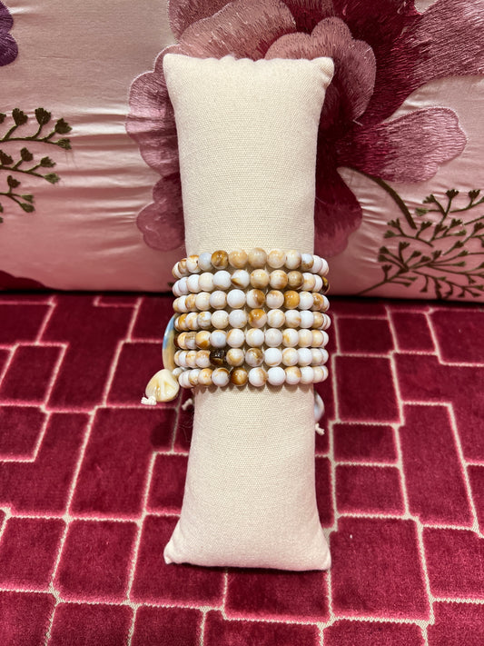 Bracciale perle beige e marroni con elementi circolari multifili