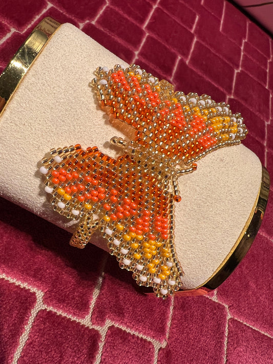 Bracciale farfalla perline oro e arancio