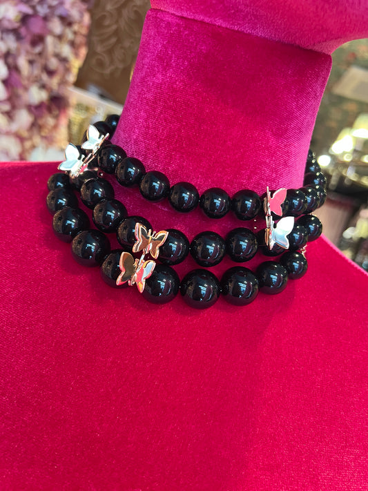 Choker a tre fili farfalle bronzo placcato oro e plexiglas nero