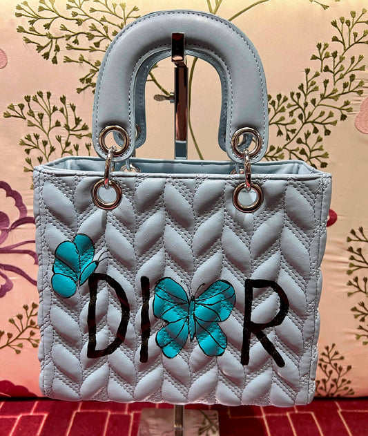 Borsa due manici ecopelle celeste con scritta dipinta a mano Dior tracolla