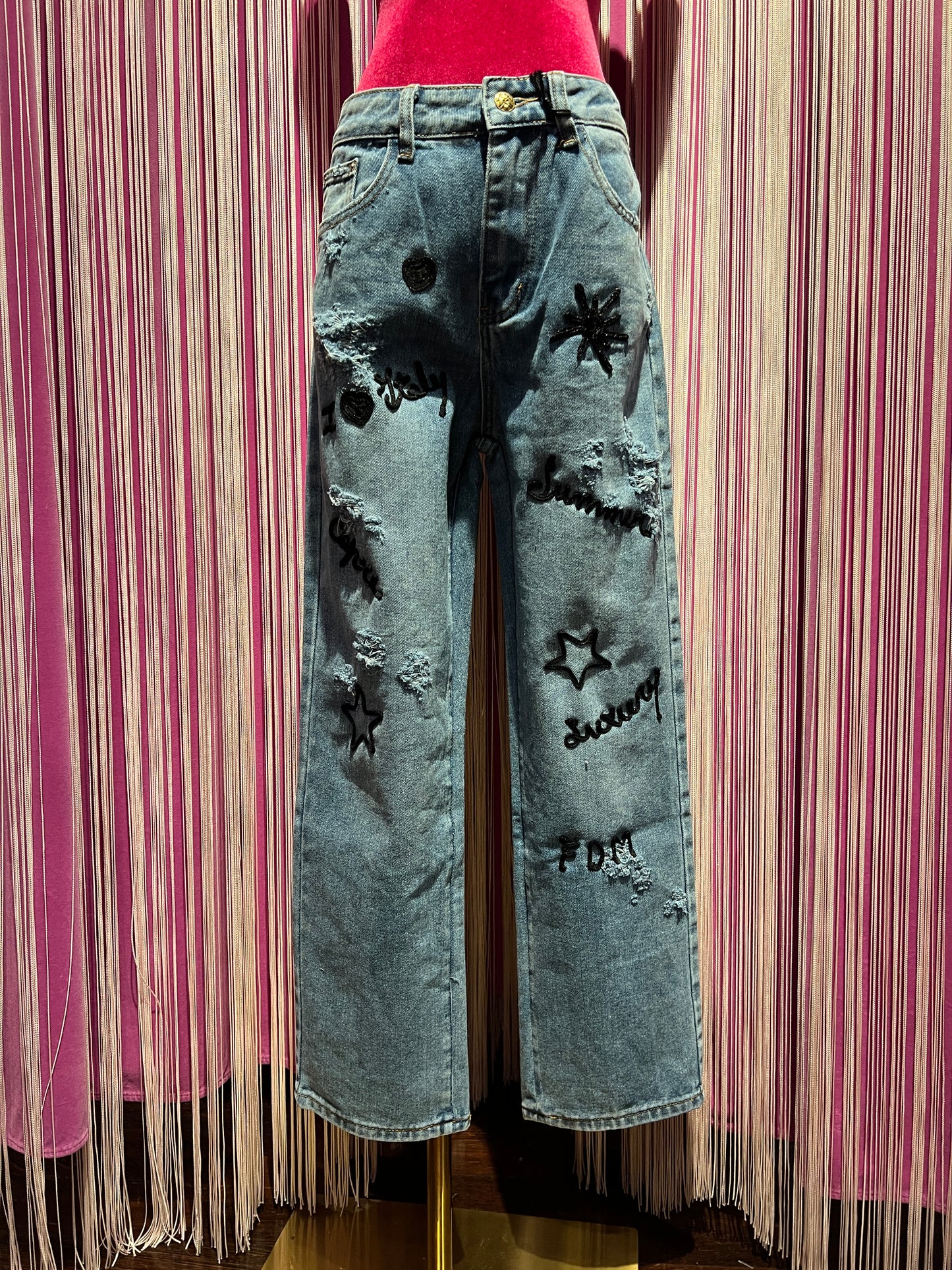 History Repeats jeans denim con scritte nere glitter