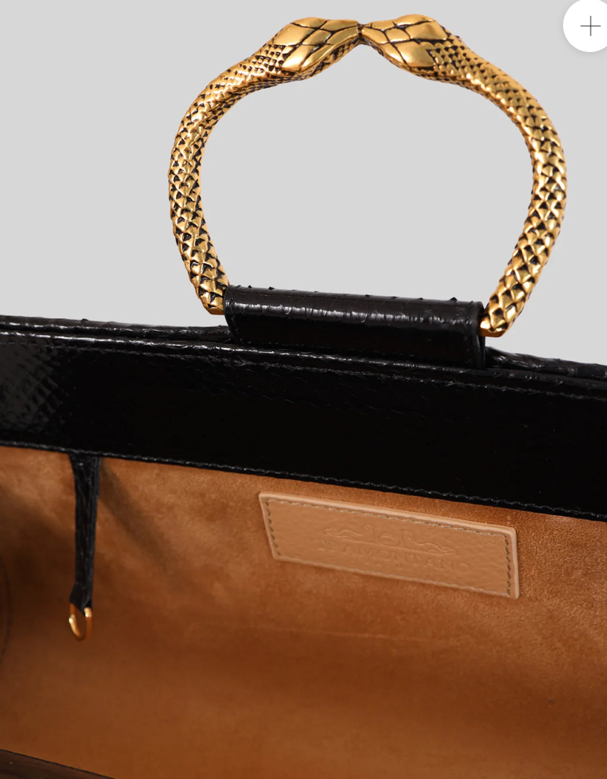 Tramontano clutch in pelle di serpente nera con bracciale in ottone e tracollina removibile