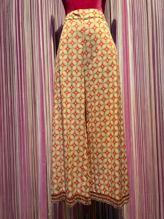 Maliparmi pantalone gamba dritta in tela di cotone , elastico in vita e frange perline , vestibilita’ asciutta