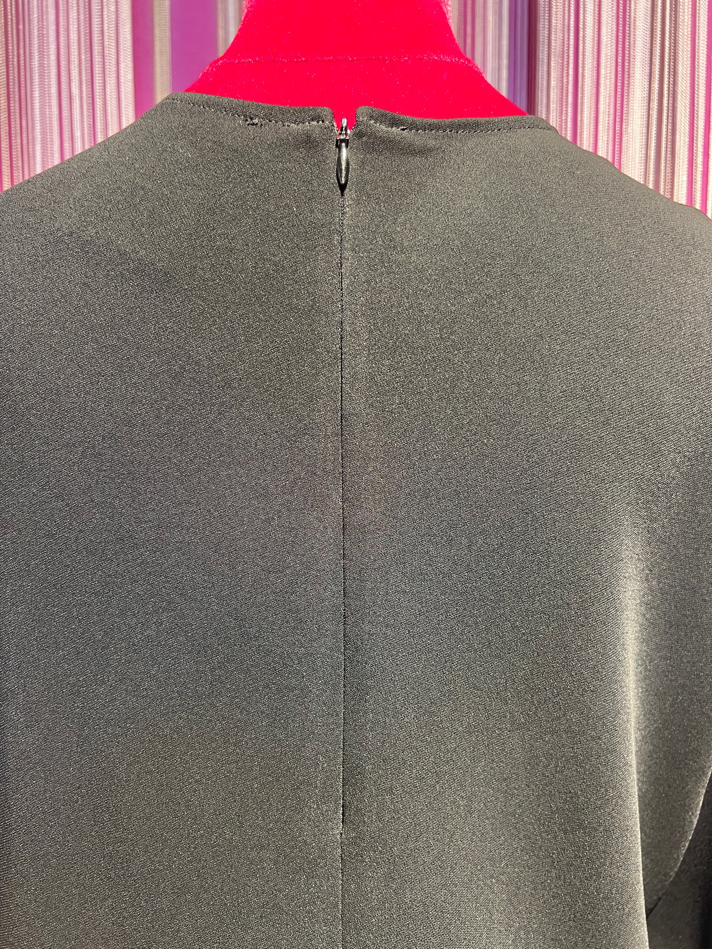 Semicouture blusa in cadi nera con drappeggio asimmetrico e bottone argento
