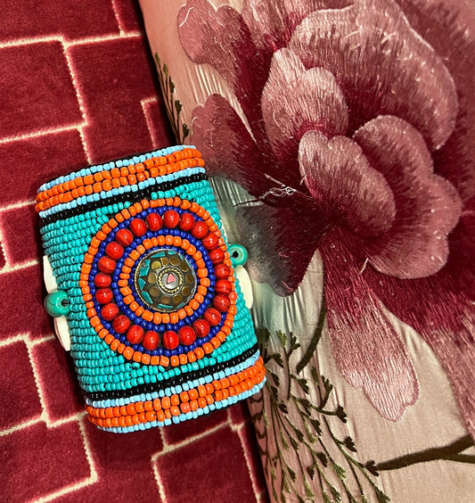 Bracciale alto con perline coralli turchesi conchiglie