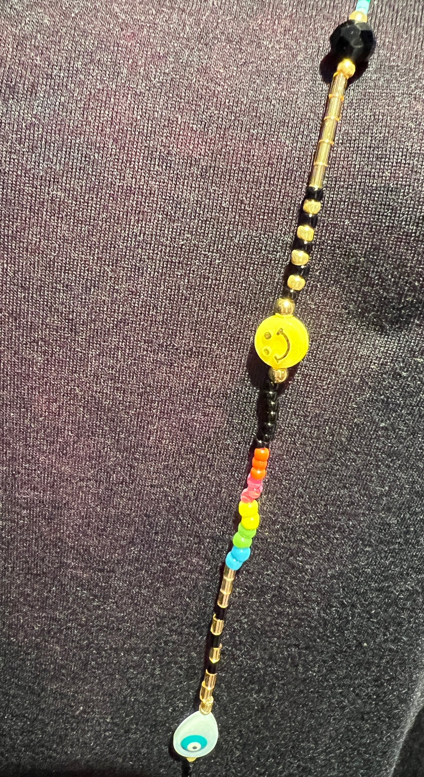 Collana lunga perline nere e multicolor con smile e occhio