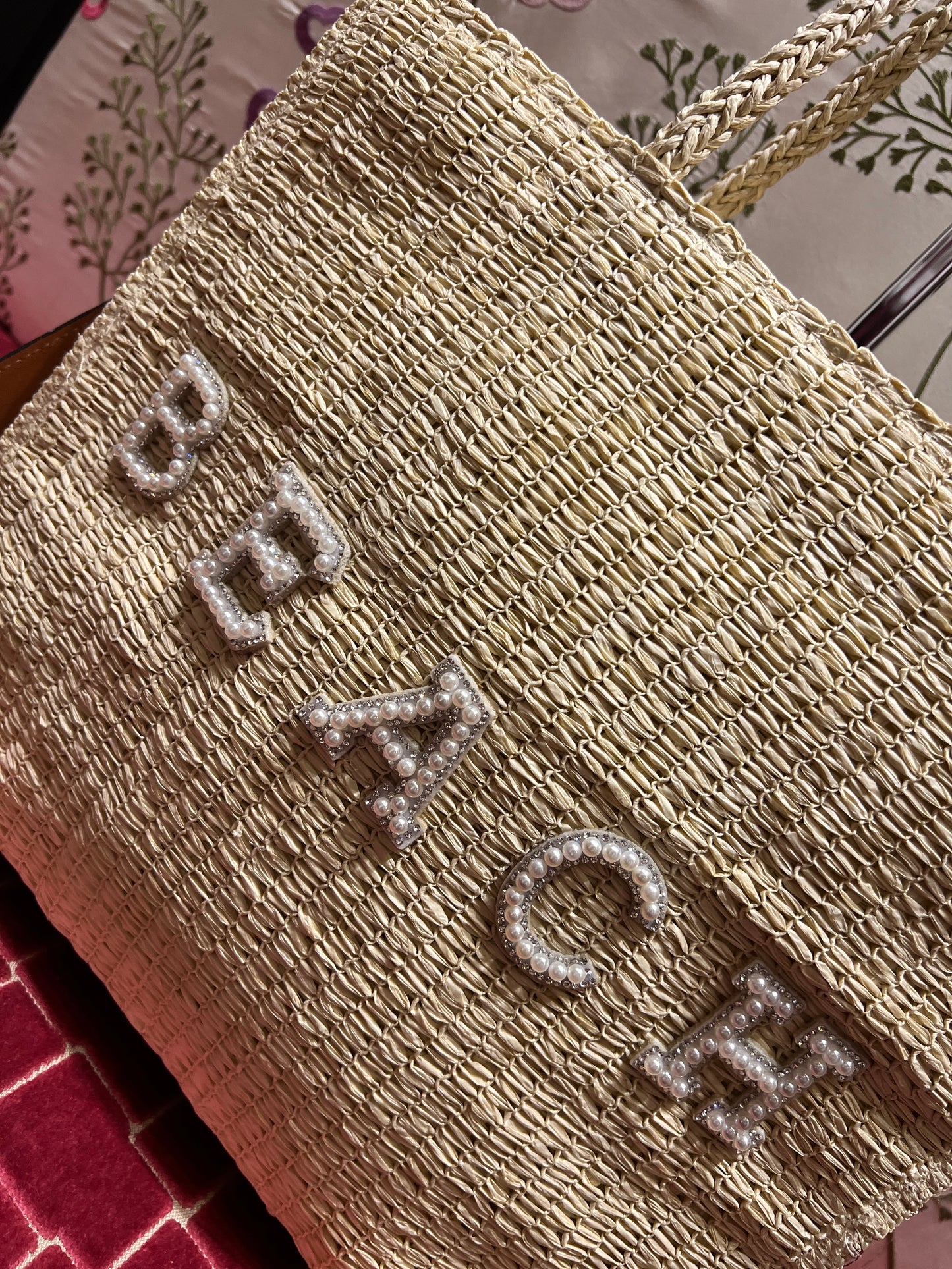 Borsa due manici in paglia intrecciata avorio con scritta “ Beach” tracolla