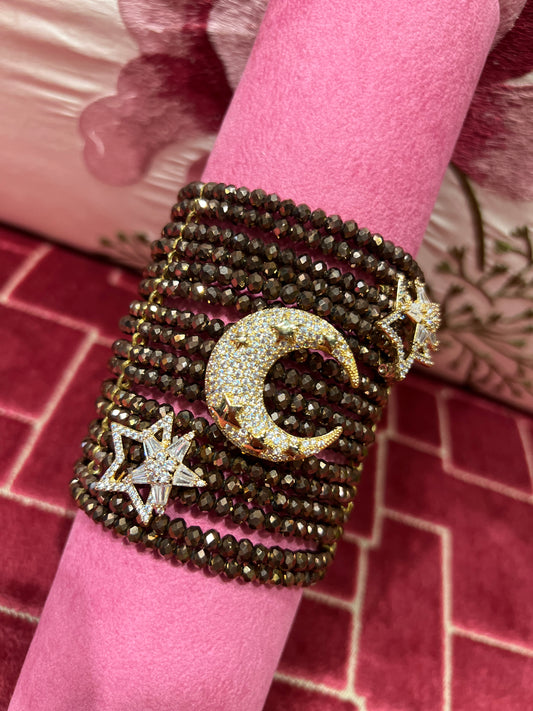 Manuela Ajo’ creazioni bracciale cristalli bronzo/marrone con spille mezza luna e stelle strass