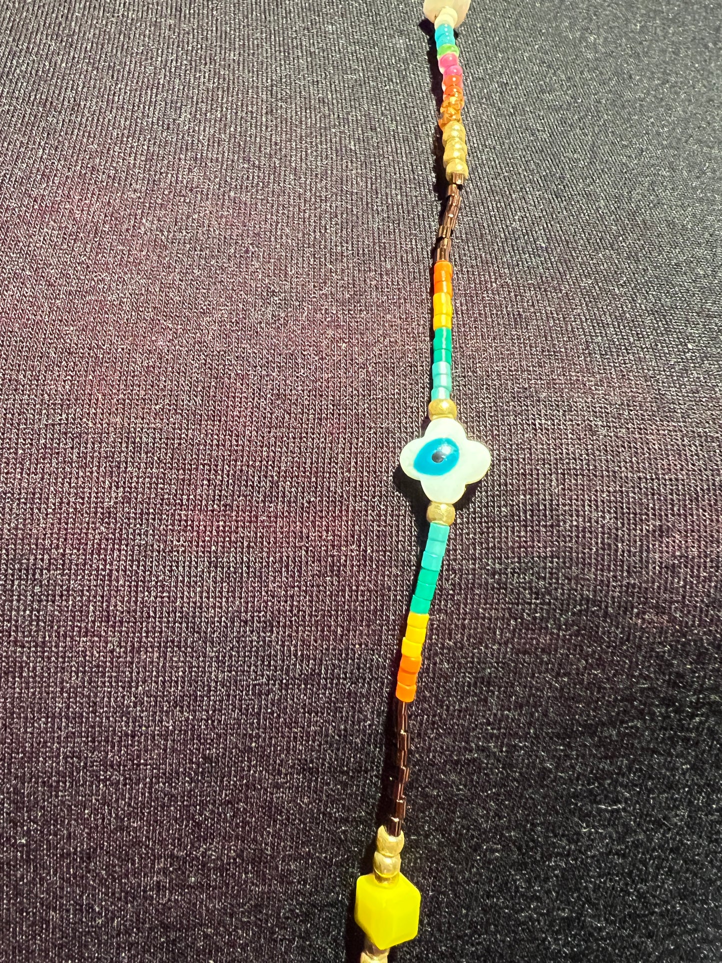 Collana lunga perline beige e multicolor con smile e occhio