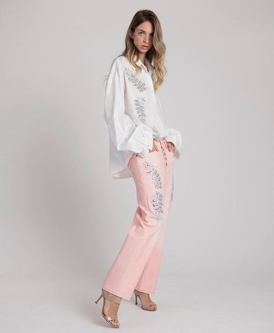 Rossano Perini jeans modello loose rosa pesca con foglie di luce