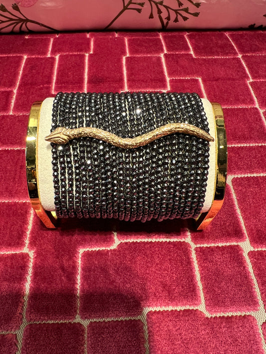 Manuela Ajo creazioni bracciale pietre ematite piombo serpente oro