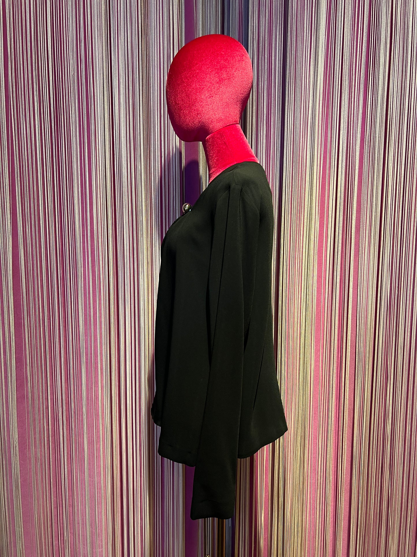 Semicouture blusa in cadi nera con drappeggio asimmetrico e bottone argento