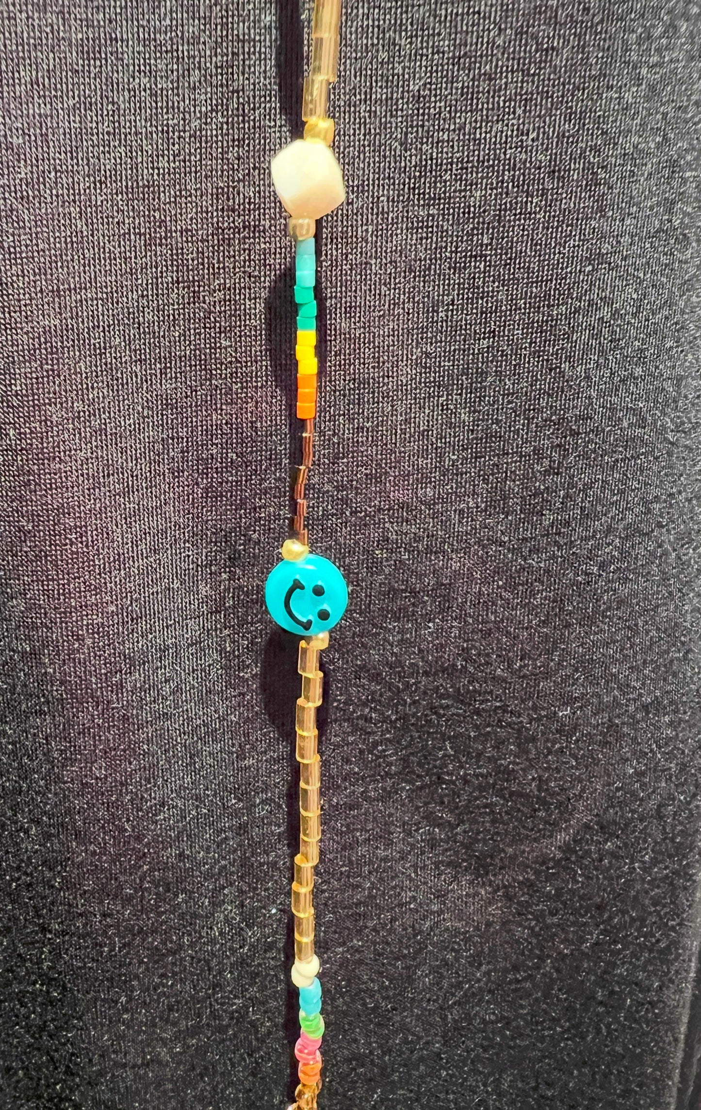Collana lunga perline beige e multicolor con smile e occhio