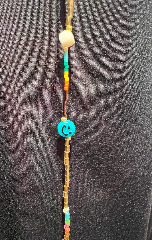 Collana lunga perline beige e multicolor con smile e occhio
